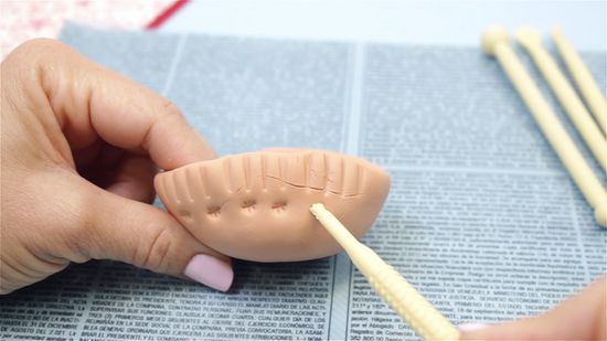 a women is making the clay