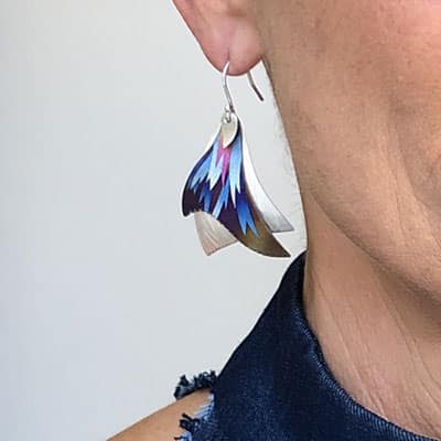 a women wearing a niobium earring