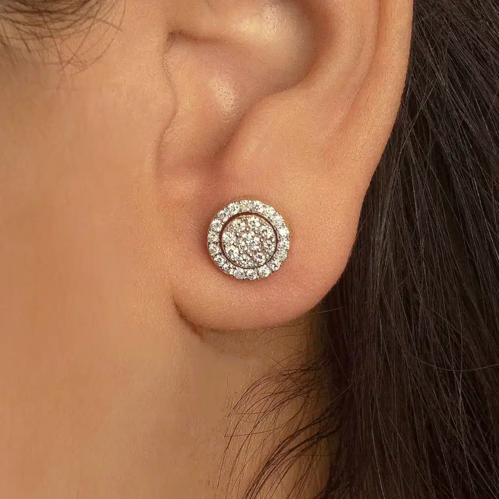 a women wearing a white studded earring