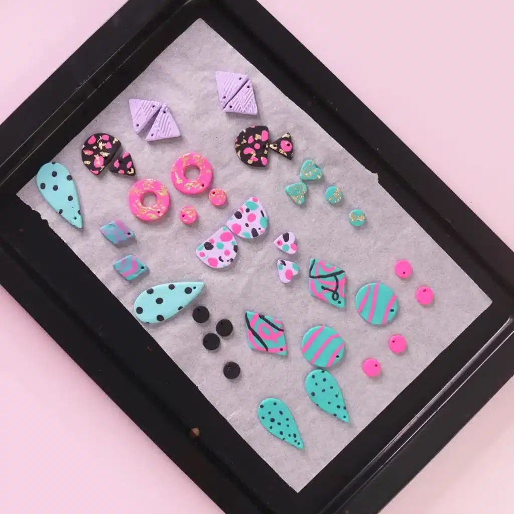 different polymar clay earrings in a baking tray