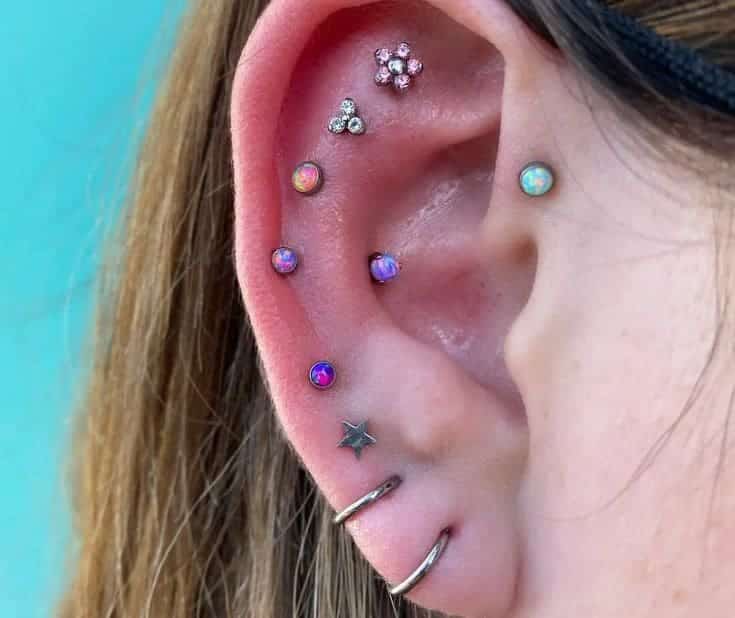 an ear of a lady having multiple Delicate Snug Piercings