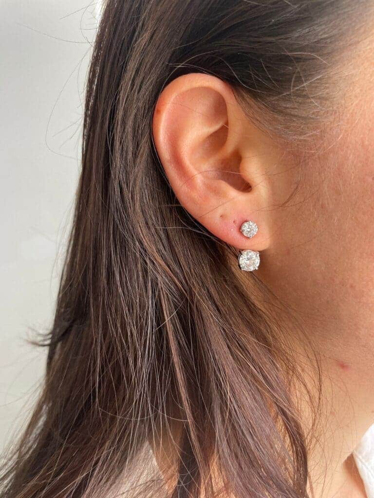 Jack Studs earring in an ear of a woman