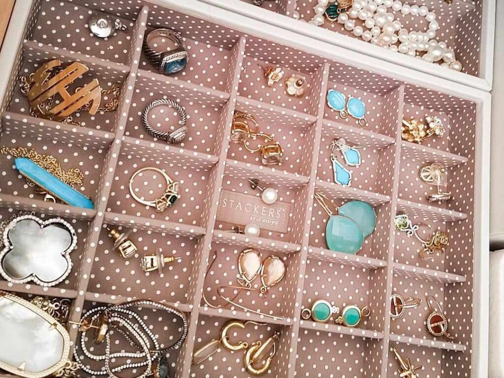 jewelery organized in different compartments of a jewelery organizer