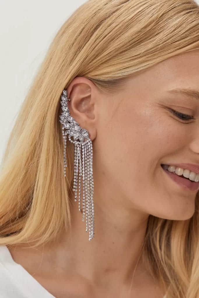 a smiling face of a lady wearing a Statement Ear Cuffs