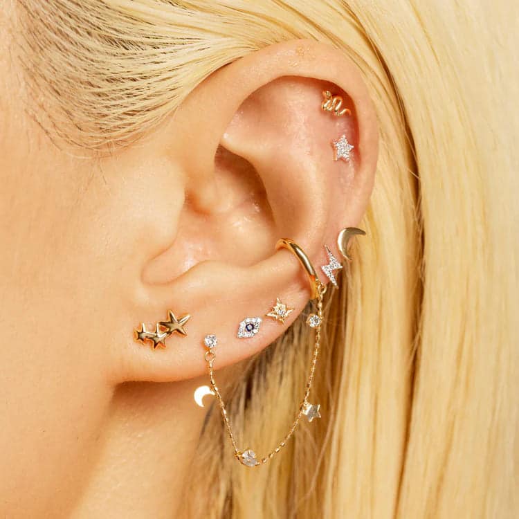 different types of earrings worn in an ear earcuffs