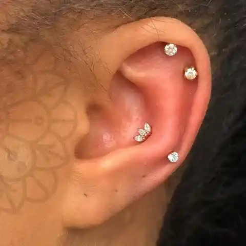 Snug Piercing adorned with diamond earrings