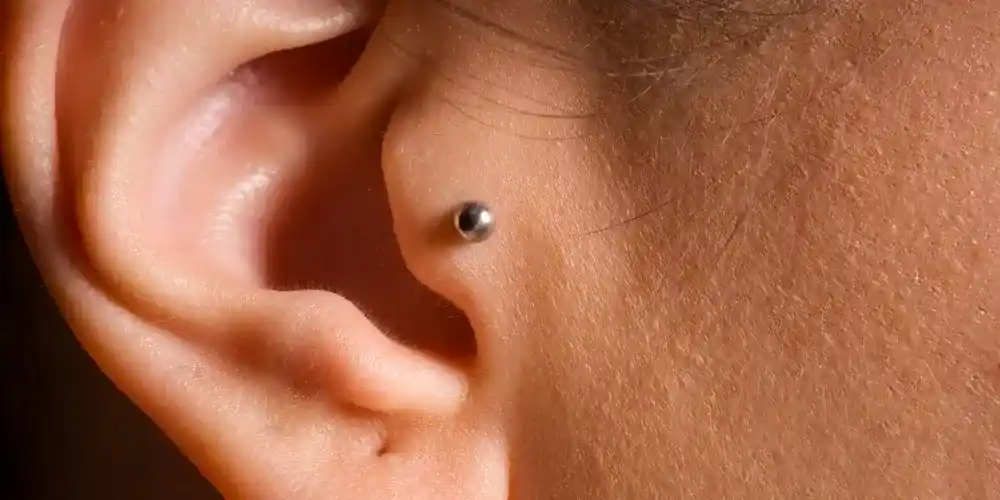 Tragus Piercing with a mini stud