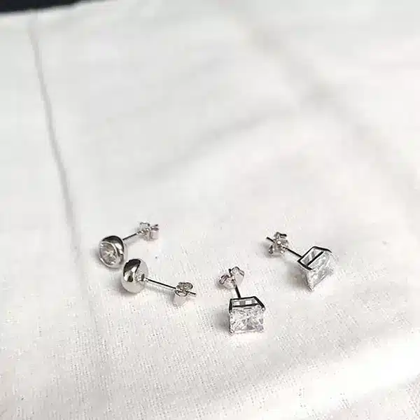 diamond earrings on a white cloth