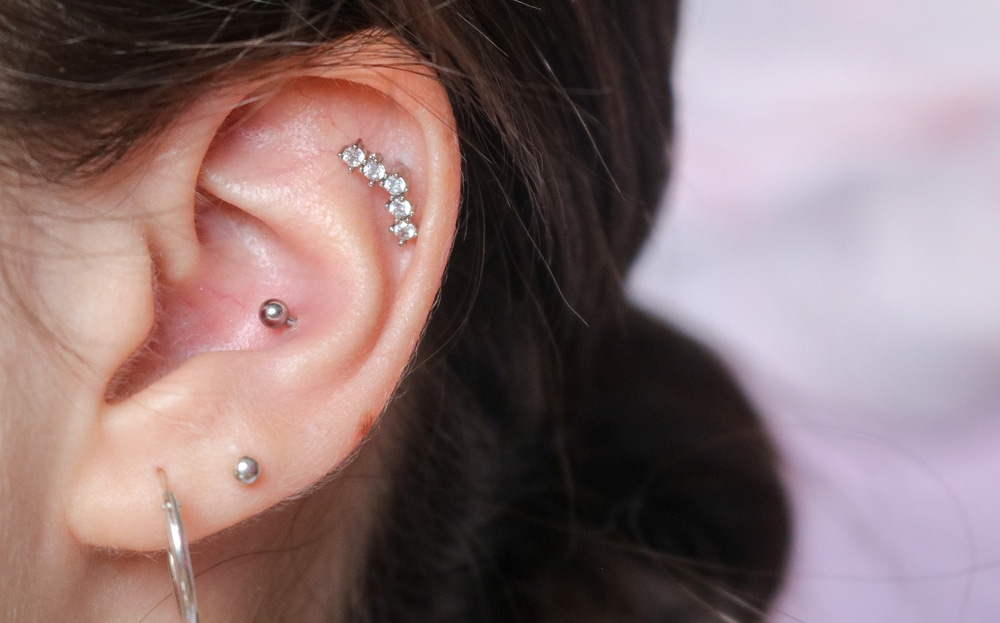 different piercings on an ear Conch and helix piercings close up