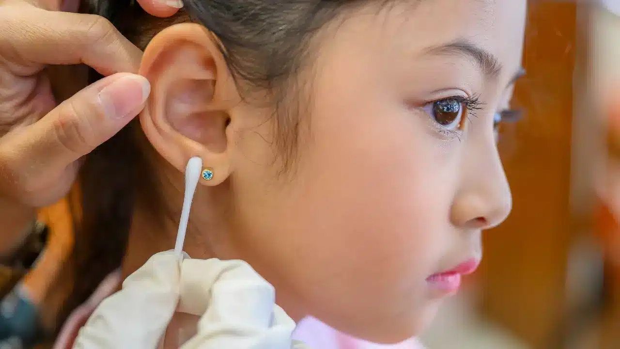 cleaning of a kid ear piercing