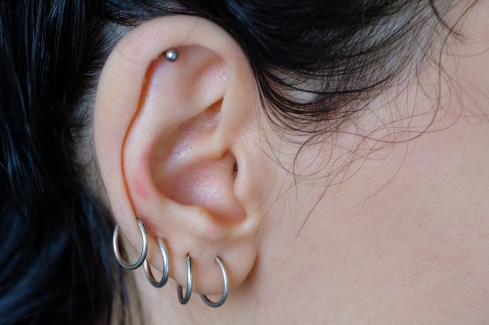 Piercings On An Ear with Different Types Of Women