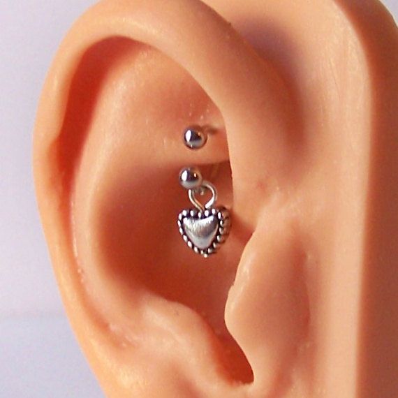 helix daith piercing in an ear zoomed in view helix daith piercing in an ear zoomed in view