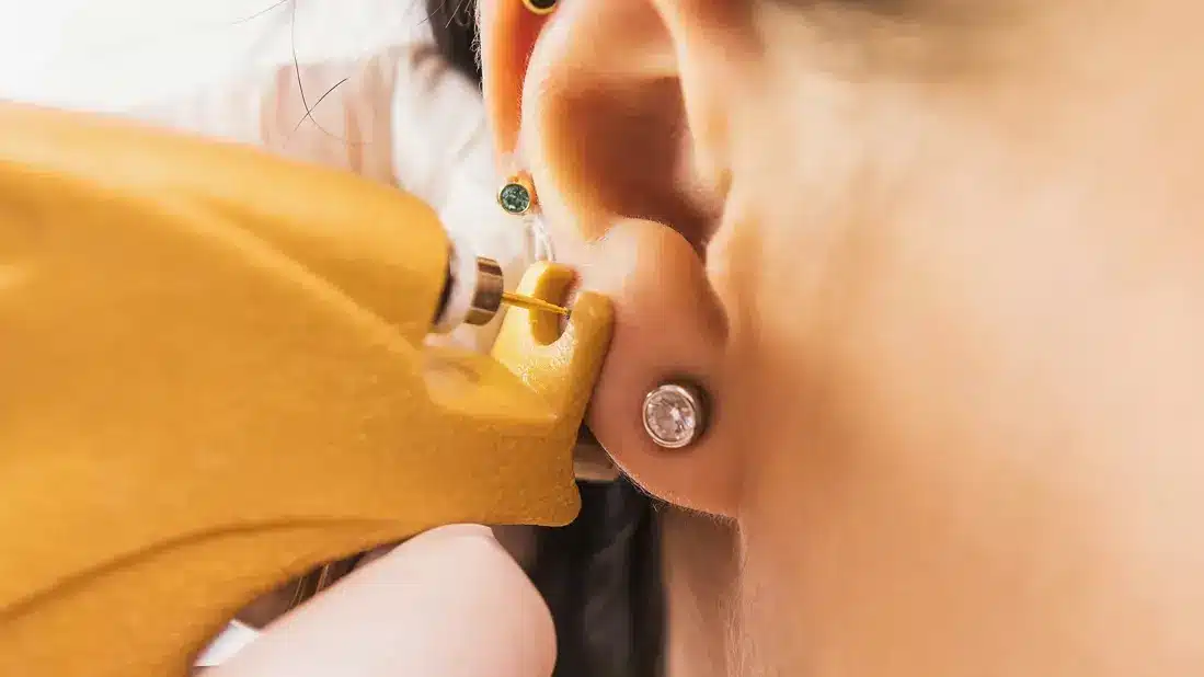 zoom in view of an ear getting pierced zoom in view of an ear getting pierced