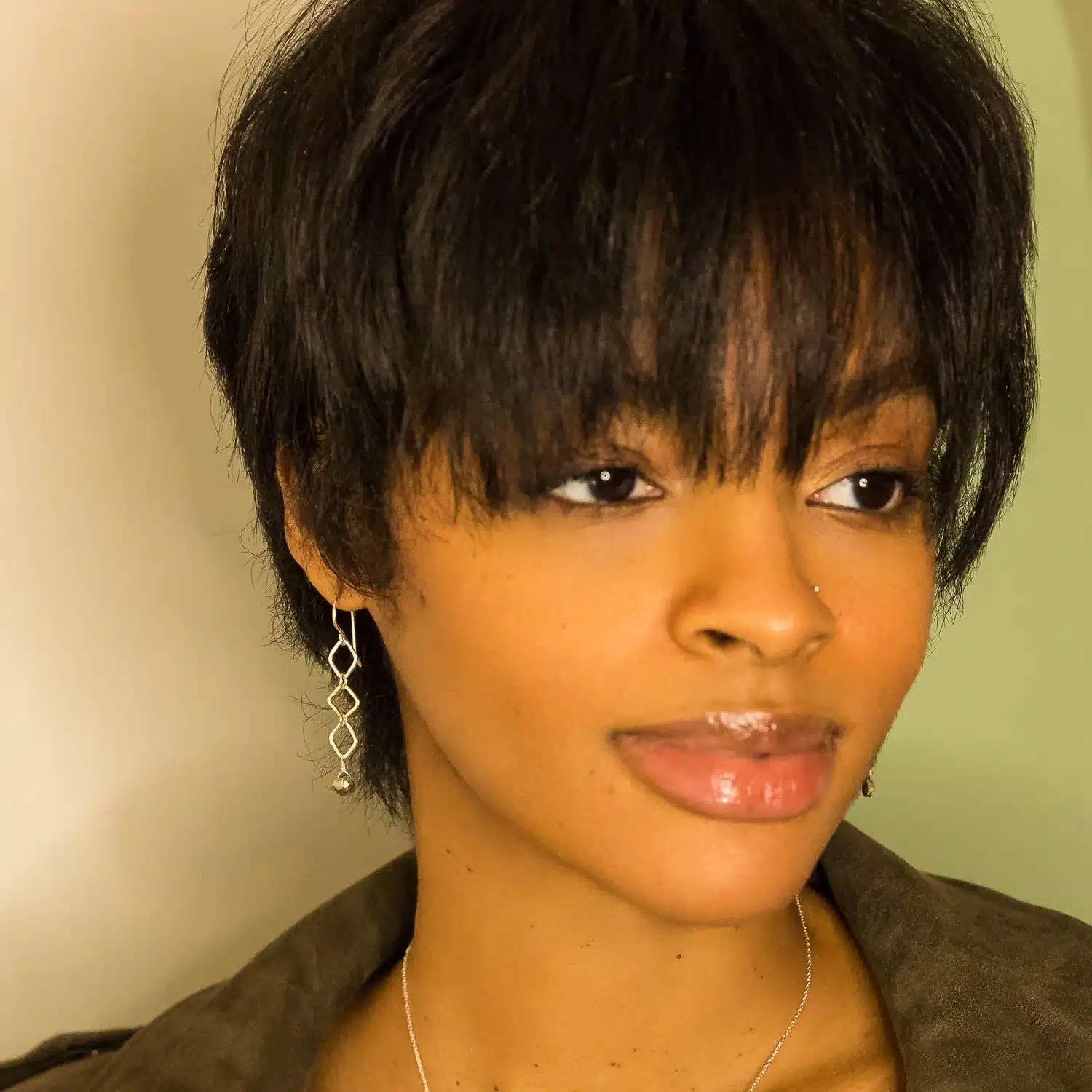 a cute girl wearing dangle and drop earrings