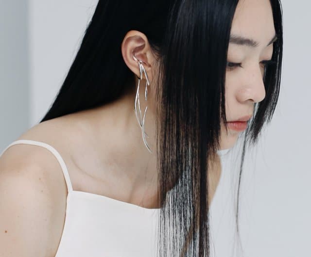 asian girl wearing ear cuffs asian girl wearing ear cuffs