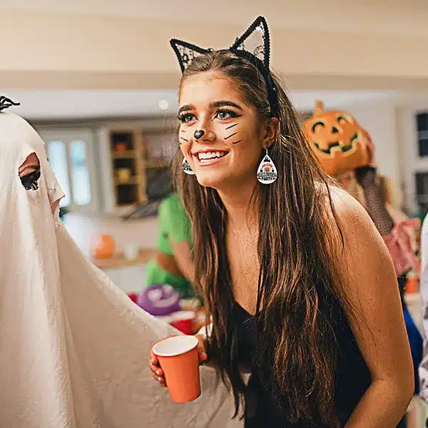 dressed up girl with halloween custome and earrings dressed up girl with halloween custome and earrings