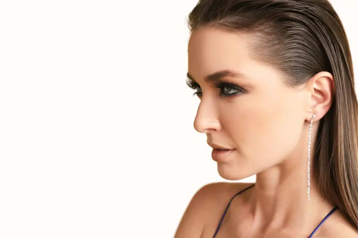 side pose of a girl wearing dangle earrings