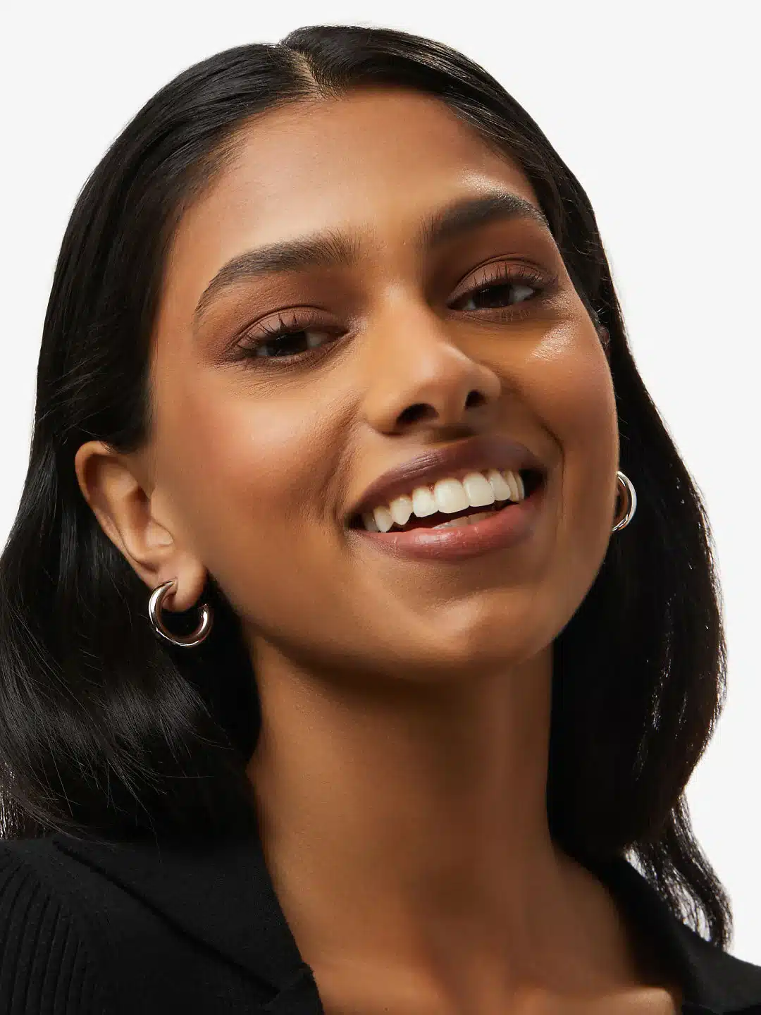 a beautiful asian girl wearing hoop earrings